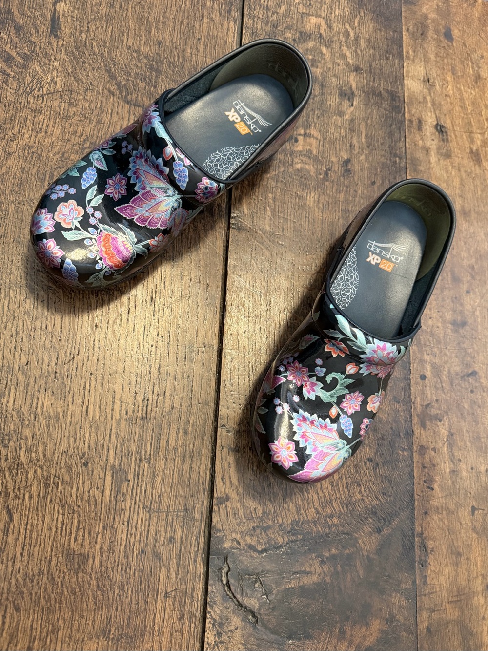 Dansko Black Patent Floral Clogs with Pink and Purple Accents
